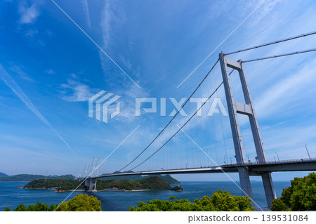 A spectacular view of the Kurushima Kaikyo Bridge and the Seto Inland Sea from Itoyama Park, the world's first triple suspension bridge, in Imabari City, Ehime Prefecture. A spectacular view of the Kurushima Kaikyo Bridge and the Seto Inland Sea from Itoyama Park, the world's first triple suspension bridge, in Imabari City, Ehime Prefecture. 139531084