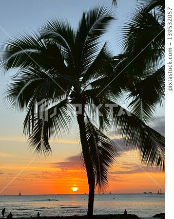 A beautiful sunset beach and palm trees in a tropical paradise. A beautiful sunset beach and palm trees in a tropical paradise. 139532057