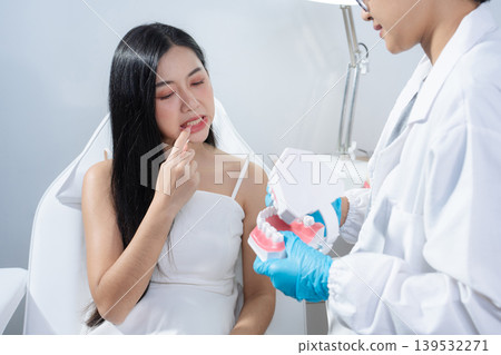 Dentist examining oral health, dental checkup and treatment. Dentist examining oral health, dental checkup and treatment. 139532271