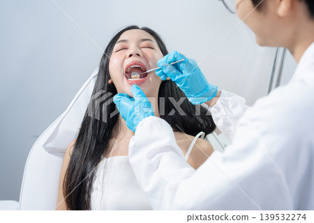 Dentist examining oral health, dental checkup and treatment. Dentist examining oral health, dental checkup and treatment. 139532274