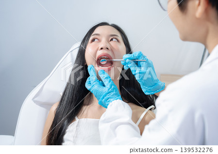 Dentist examining oral health, dental checkup and treatment. Dentist examining oral health, dental checkup and treatment. 139532276