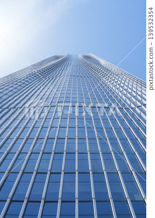 Blue sky architecture, looking up at modern glass skyscrapers. Blue sky architecture, looking up at modern glass skyscrapers. 139532354
