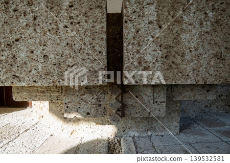 An arched architectural corner made of stacked Oya stone. An arched architectural corner made of stacked Oya stone. 139532581