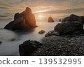 Sunset illuminating rocks and cross at Cape Fiolent 139532995