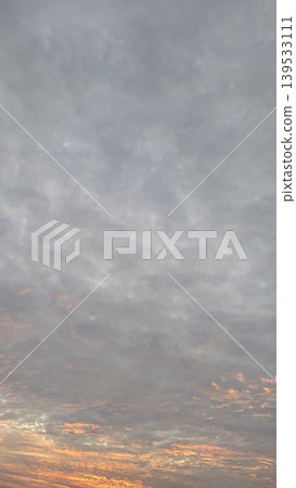 Grey overcast clouds fill the morning sky, soft light glows at the horizon. This natural atmospheric scene captures quiet weather transitions, moody dawn textures, scenic outdoor views at dawn. Grey overcast clouds fill the morning sky, soft light glows at the horizon. This natural atmospheric scene captures quiet weather transitions, moody dawn textures, scenic outdoor views at dawn. 139533111