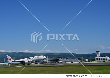 A white airplane landing A white airplane landing 139533185