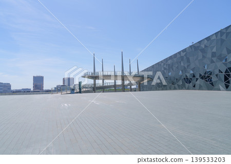 Large public building with polygonal exterior walls and circular connecting walkway Large public building with polygonal exterior walls and circular connecting walkway 139533203