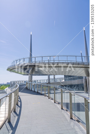 Large public building with polygonal exterior walls and circular connecting walkway Large public building with polygonal exterior walls and circular connecting walkway 139533205