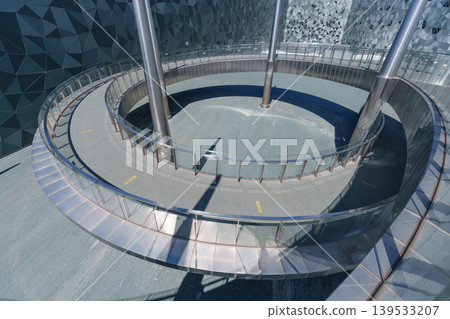 Large public building with polygonal exterior walls and circular connecting walkway Large public building with polygonal exterior walls and circular connecting walkway 139533207