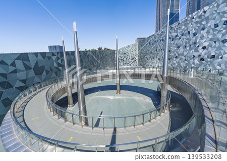 Large public building with polygonal exterior walls and circular connecting walkway Large public building with polygonal exterior walls and circular connecting walkway 139533208