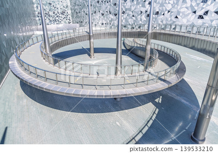Large public building with polygonal exterior walls and circular connecting walkway Large public building with polygonal exterior walls and circular connecting walkway 139533210