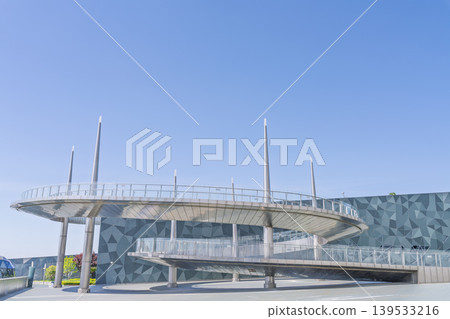 Large public building with polygonal exterior walls and circular connecting walkway Large public building with polygonal exterior walls and circular connecting walkway 139533216