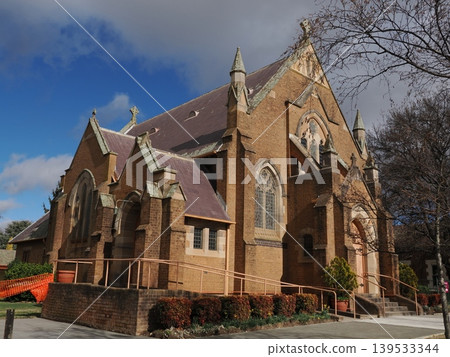 The sanctuary's exterior, with its many gables—the imposing structural beauty of the Holy Trinity Anglican Church. The sanctuary's exterior, with its many gables—the imposing structural beauty of the Holy Trinity Anglican Church. 139533344