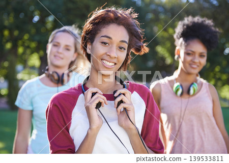 College, students and portrait in the park with headphones on campus to study together with happiness and friends. University, academy and people with diversity or solidarity in education mission College, students and portrait in the park with headphones on campus to study together with happiness and friends. University, academy and people with diversity or solidarity in education mission 139533811