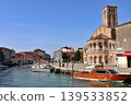 Murano, off the coast of Venice, Italy: Santi Maria e Donato Church and a water taxi. 139533852