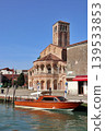 Murano, off the coast of Venice, Italy: Santi Maria e Donato Church and a water taxi. 139533853