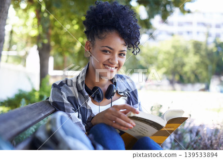 Woman, student and portrait for book reading on university bench for study, education or learning. Female person, face and smile at college campus or outdoor for knowledge, scholarship or research Woman, student and portrait for book reading on university bench for study, education or learning. Female person, face and smile at college campus or outdoor for knowledge, scholarship or research 139533894