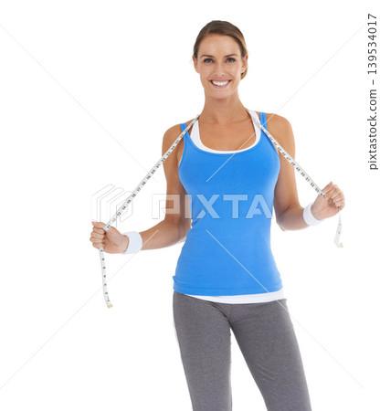 Woman, portrait and measure tape in studio for fitness, weight loss or health results with training progress. Happy model or active person with exercise, gym or workout diet on a white background 139534017