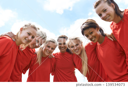 Team, women and happy with sport portrait for support, celebration or solidarity with blue sky and low angle. Collaboration, athlete and people with smile outdoor for fitness, exercise or competition Team, women and happy with sport portrait for support, celebration or solidarity with blue sky and low angle. Collaboration, athlete and people with smile outdoor for fitness, exercise or competition 139534073
