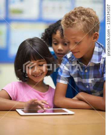 Children, learning and tablet in classroom for online education, scroll on school website and information in group. Happy students or kids on digital technology for knowledge, reading and development Children, learning and tablet in classroom for online education, scroll on school website and information in group. Happy students or kids on digital technology for knowledge, reading and development 139534107