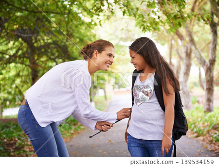 Woman, smile and student in park with bonding, preparation and wellness with love in city outdoor. Mother, daughter and helping with backpack, care and happy together for back to school in urban town Woman, smile and student in park with bonding, preparation and wellness with love in city outdoor. Mother, daughter and helping with backpack, care and happy together for back to school in urban town 139534159