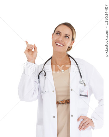 Happy woman, portrait or doctor pointing up to ideas at mockup space on white background in studio. Marketing, advertising or nurse thinking of medical healthcare information, wellness or advice Happy woman, portrait or doctor pointing up to ideas at mockup space on white background in studio. Marketing, advertising or nurse thinking of medical healthcare information, wellness or advice 139534407