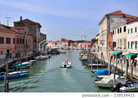 Murano, off the coast of Venice, Italy: The San Donato Canal as seen from the San Donato Bridge. Murano, off the coast of Venice, Italy: The San Donato Canal as seen from the San Donato Bridge. 139534433