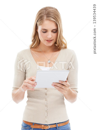 Woman, app reading and tablet in studio with social networking, online blog and tech with white background. News, email and digital scroll with information for web search, media and internet article 139534439