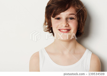 Child, smile and portrait for fashion in studio, cool clothing and confidence by white background. Happy male person, kid and vest by backdrop or pride for style, face and trendy outfit or relaxing Child, smile and portrait for fashion in studio, cool clothing and confidence by white background. Happy male person, kid and vest by backdrop or pride for style, face and trendy outfit or relaxing 139534509