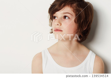 Child, boy and thinking on fashion in studio, cool clothing and confidence by white background. Male person, kid and vest by backdrop or pride for style, relaxing and trendy outfit or wondering Child, boy and thinking on fashion in studio, cool clothing and confidence by white background. Male person, kid and vest by backdrop or pride for style, relaxing and trendy outfit or wondering 139534514