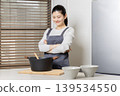 Image of a woman cooking, doing housework, and cooking for herself. 139534550