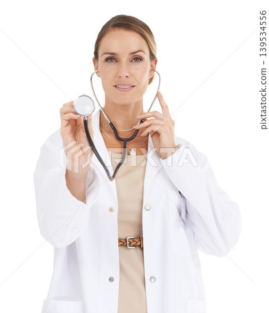 Doctor, woman and stethoscope in a studio portrait for cardiology, healthcare and support or check. Professional medical worker listening for checkup, patient POV and services on a white background Doctor, woman and stethoscope in a studio portrait for cardiology, healthcare and support or check. Professional medical worker listening for checkup, patient POV and services on a white background 139534556