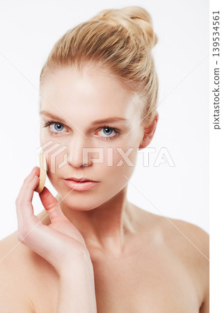 Cotton pad, skincare or portrait of a woman in studio for cleaning, beauty or dermatology treatment. White background, face or confident model with pad for facial, toner and cosmetics with foundation 139534561