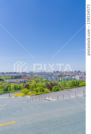 A panoramic view of the lush city from the rooftop. A panoramic view of the lush city from the rooftop. 139534573