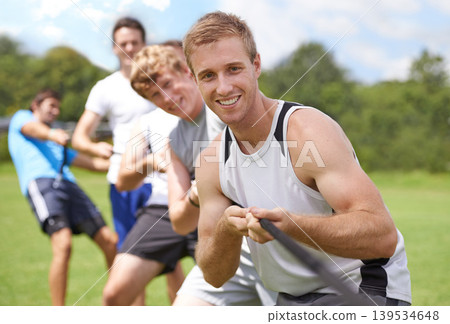 Rope, pull and men portrait with teamwork, tug of war and fitness outdoor on sport field. Training, workout and athlete group with support together for competition and strong arm exercise for health Rope, pull and men portrait with teamwork, tug of war and fitness outdoor on sport field. Training, workout and athlete group with support together for competition and strong arm exercise for health 139534648