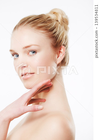 Portrait of model, touching face or skincare for wellness with cosmetics, aesthetic or healthy glow. Facial dermatology, studio or confident woman with pride or beauty results on white background Portrait of model, touching face or skincare for wellness with cosmetics, aesthetic or healthy glow. Facial dermatology, studio or confident woman with pride or beauty results on white background 139534811