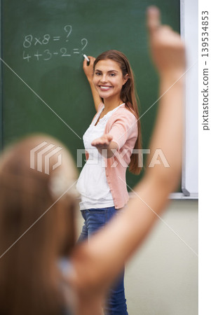 Teacher, hands and children in classroom with answer, learning and discussion for education or math. Woman, school kids and happy with studying, knowledge and raised hand for scholarship or lesson Teacher, hands and children in classroom with answer, learning and discussion for education or math. Woman, school kids and happy with studying, knowledge and raised hand for scholarship or lesson 139534853