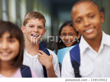 Friends, portrait and happy in corridor of school with backpack for learning, education and knowledge. Student, person and face with smile in building before class or ready to study with diversity Friends, portrait and happy in corridor of school with backpack for learning, education and knowledge. Student, person and face with smile in building before class or ready to study with diversity 139534912