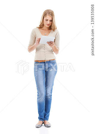 Woman, typing and tablet in studio with social networking, online blog and tech app with white background. News, email and digital scroll with information for web search, media and internet article 139535008