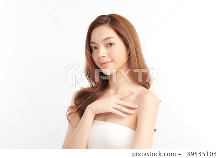 A beautiful young Asian woman with clean, fresh skin against a white background. Skincare, facial treatment, cosmetology, beauty, and spa. An elegant portrait of an Asian woman. A beautiful young Asian woman with clean, fresh skin against a white background. Skincare, facial treatment, cosmetology, beauty, and spa. An elegant portrait of an Asian woman. 139535103