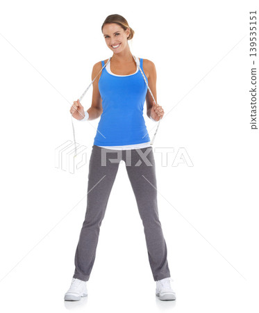 Fitness, measuring tape and portrait of woman in a studio for exercise, training or workout. Sports, smile and young happy female person with equipment for weight loss isolated by white background. Fitness, measuring tape and portrait of woman in a studio for exercise, training or workout. Sports, smile and young happy female person with equipment for weight loss isolated by white background. 139535151