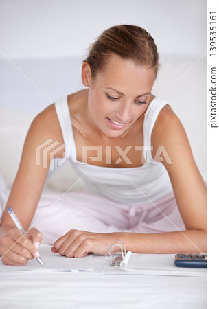 Happy woman, writing and documents in bed for budget planning, expenses or finance at home. Female person smile with notebook or calculator for morning or financial checklist in bedroom at house Happy woman, writing and documents in bed for budget planning, expenses or finance at home. Female person smile with notebook or calculator for morning or financial checklist in bedroom at house 139535161