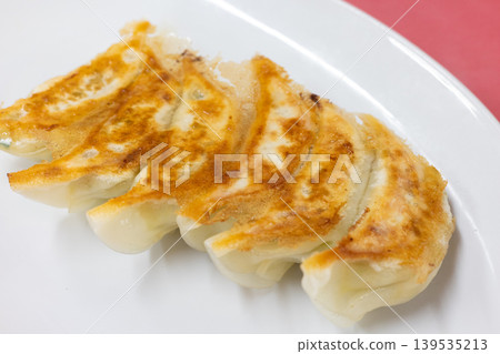 Delicious pan-fried dumplings from a local Chinese restaurant 139535213