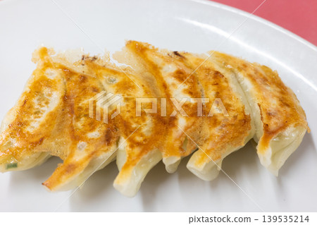 Delicious pan-fried dumplings from a local Chinese restaurant Delicious pan-fried dumplings from a local Chinese restaurant 139535214