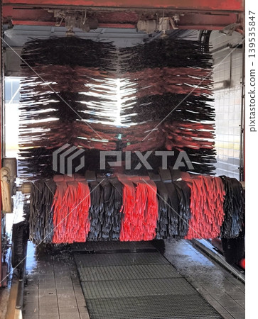 Automatic portal car wash brushes in operation Automatic portal car wash brushes in operation 139535847