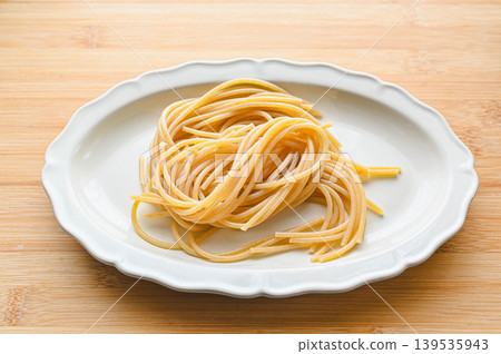 whole wheat pasta noodles served on a plate whole wheat pasta noodles served on a plate 139535943