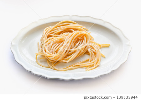 whole wheat pasta noodles served on a plate 139535944