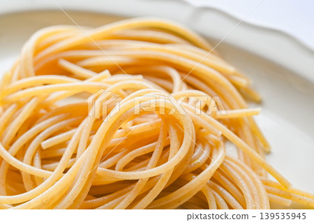whole wheat pasta noodles served on a plate 139535945
