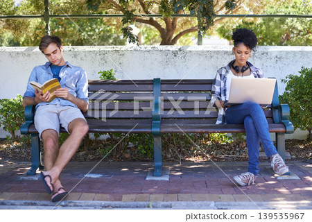 College, campus and students in the park study on a bench with laptop, book and reading. University, academy and people sitting outdoor learning with research, project and knowledge for education College, campus and students in the park study on a bench with laptop, book and reading. University, academy and people sitting outdoor learning with research, project and knowledge for education 139535967