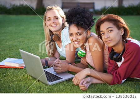 Portrait, laptop or friends on grass at college, campus or together with online course, smile or group. University, relax or happy students bond with support, teamwork or diversity in education Portrait, laptop or friends on grass at college, campus or together with online course, smile or group. University, relax or happy students bond with support, teamwork or diversity in education 139536012